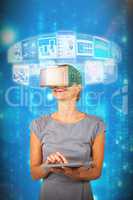 Composite image of woman holding digital tablet and using virtual reality headset 3d