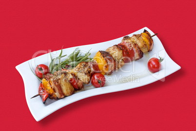 Skewers of meat and vegetables on the grill