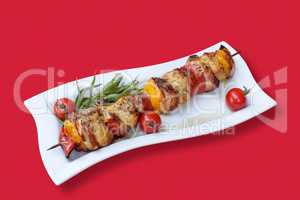 Skewers of meat and vegetables on the grill