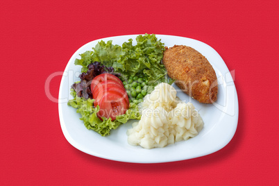 Mashed potatoes with cutlet and vegetables
