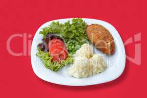 Mashed potatoes with cutlet and vegetables