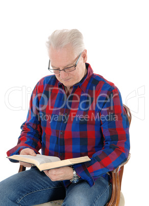 Senior man studding the bible.