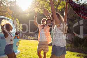 Group of friends dancing in the park