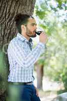 Man having wine in the park