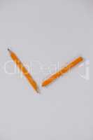 Broken pencil on white background