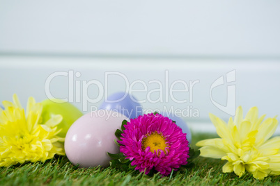 Multicolored Easter egg on grass