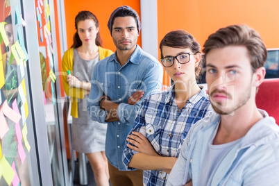 Portrait of executives standing with arms crossed Portrait of executives standing with arms crossed