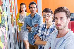 Portrait of executives standing with arms crossed