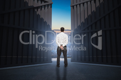 Composite image of businessman turning his back to camera 3d