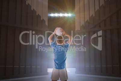 Composite image of rugby player holding a rugby ball 3d