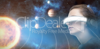 Composite image of low angle view of woman trying virtual reality 3d