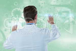 Composite image of rear view of doctor touching transparent interface 3d