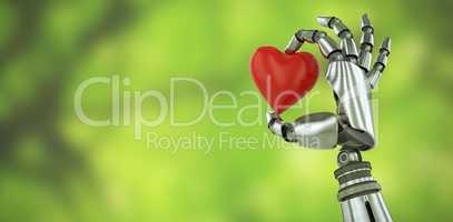 Composite image of 3d image of robot hand holding red heard shape decoration