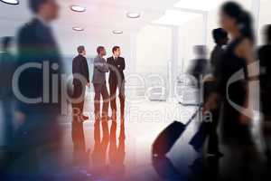 Composite image of business colleagues looking