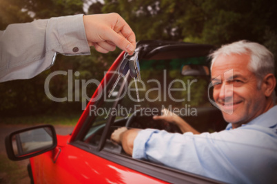 Composite image of man giving keys to someone