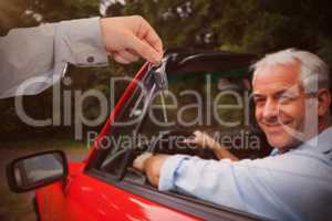 Composite image of man giving keys to someone