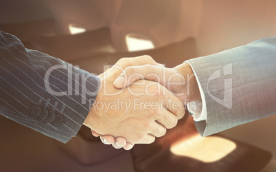 Composite image of business people shaking hands