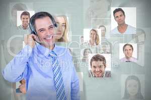 Composite image of smiling businessman using headset