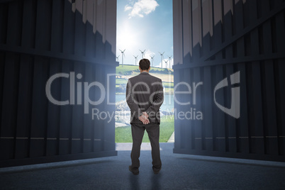 Composite image of rear view of classy businessman posing 3d
