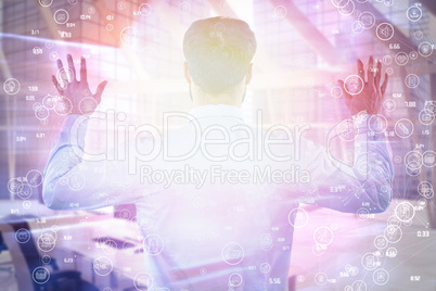 Composite image of rear view of entrepreneur pretending to use invisible screen 3d