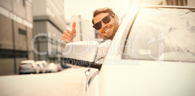 Happy businessman with thumbs up