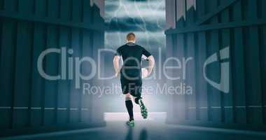 Composite image of rugby player running with a rugby ball 3d