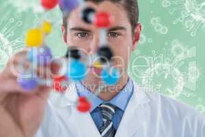 Composite image of young scientist experimenting molecule structure 3d