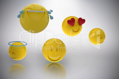 Composite image of three dimensional image of smiling emoticons 3d
