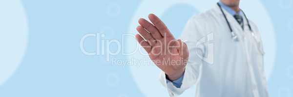 Composite image of doctor touching an digital screen