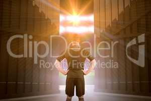 Composite image of rugby player with hands on hips 3d
