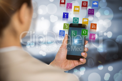 Composite image of businesswoman using mobile phone 3d