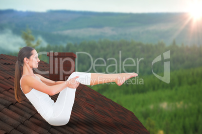 Composite image of toned woman doing the boat pose in fitness studio