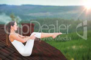 Composite image of toned woman doing the boat pose in fitness studio