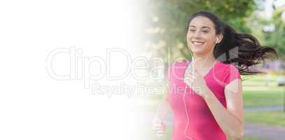 Sporty pretty woman jogging in a park