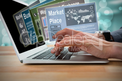 Composite image of cropped image of businessman typing on laptop 3d