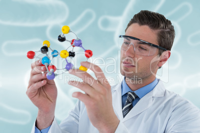 Composite image of scientist experimenting molecule structure 3d