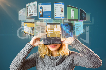 Composite image of smiling blond woman using virtual reality headset 3d