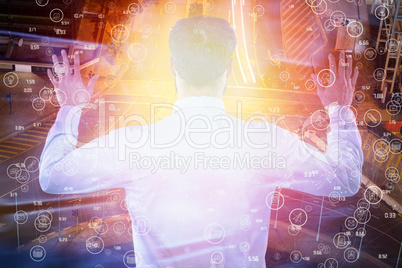 Composite image of rear view of entrepreneur pretending to use invisible screen 3d