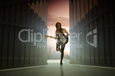 Composite image of pretty young girl playing her guitar 3d