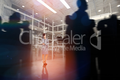 Composite image of silhouette of business people walking