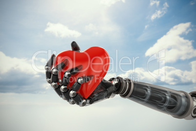 Composite image of three dimensional image of cyborg holding red heart shape decoration 3d
