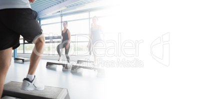 Trainer stepping with aerobics class