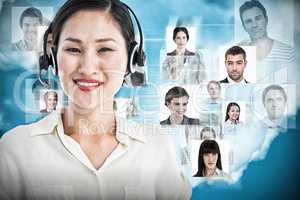 Composite image of beautiful smiling female executive with headset