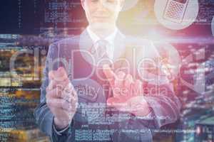 Composite image of businessman using futuristic digital tablet 3d