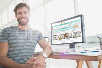 Composite image of  portrait of a casual businessman posing and smiling