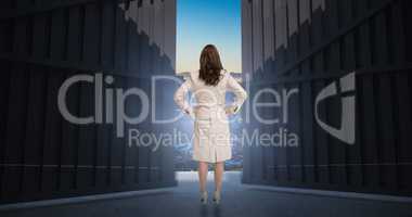 Composite image of businesswoman standing back to camera 3d