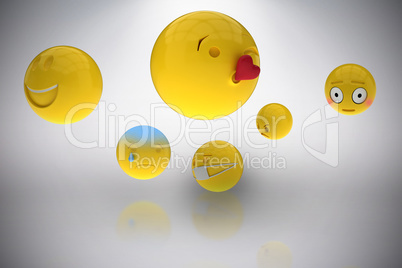 Composite image of three dimensional image of basic emoticons 3d