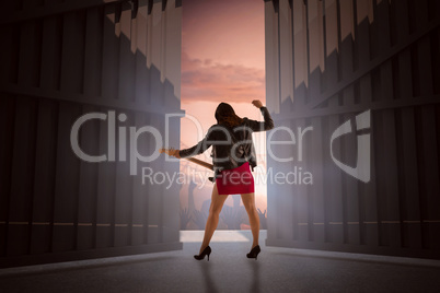 Composite image of brunette in biker jacket playing guitar 3d