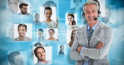 Composite image of businessman with executives using computers