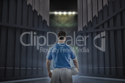 Composite image of rugby player holding a rugby ball 3d